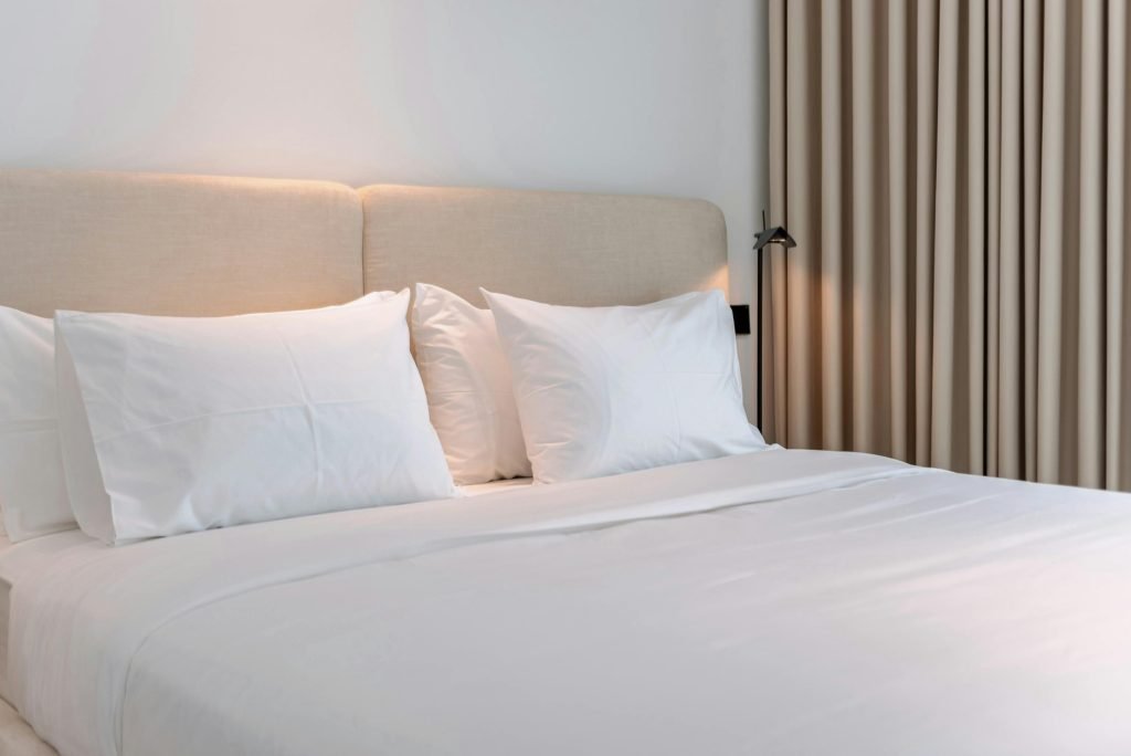 pexels photo 33197282 33197282 Inviting modern bedroom with beige accents, perfect for a cozy vacation rental stay.